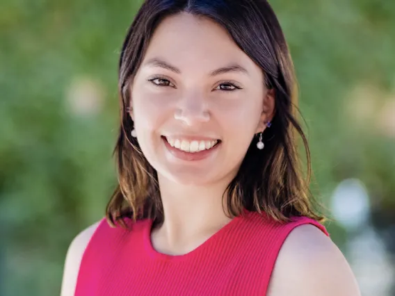 Headshot of Audrey in a pink shirt