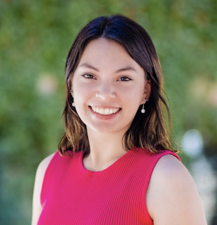 Headshot of Audrey in a pink shirt